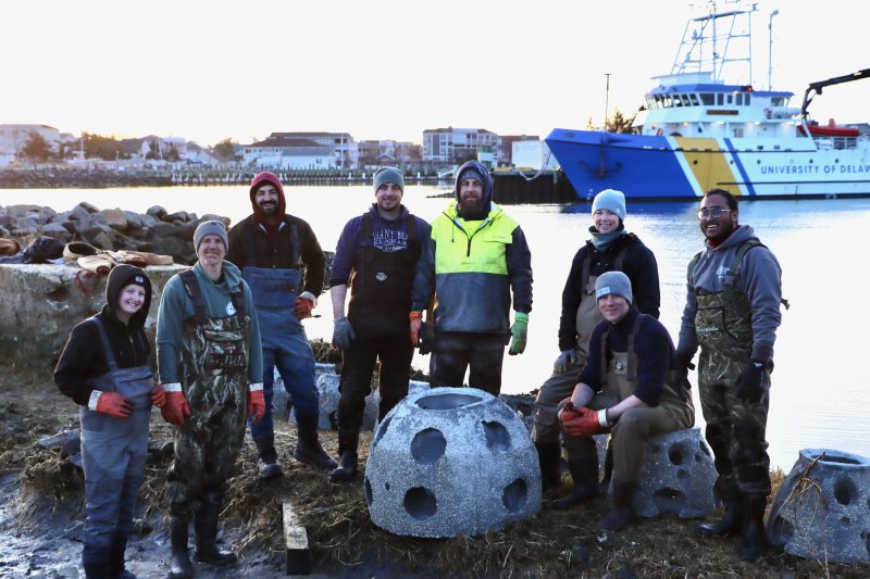 The UD team poses among the oyster castles. Shown are (l-r) Rileigh Hudock, Jack Puleo, Brenden Campbell, Daniel Millea, Ed Hale, Leigh Muldrow, Calum Pritchard and Parvez Hossain.